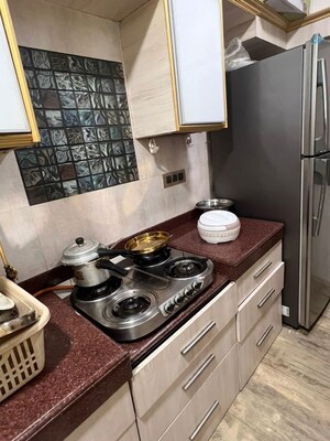 Kitchen in 2 BHK Apartment at Versova Denzil CHS, Andheri West – for Rent