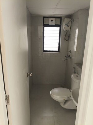Bathroom in 2 BHK Apartment at Runwal Gardens, Dombivli East – for Rent