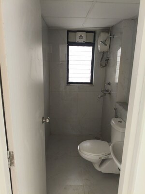 Bathroom in 2 BHK Apartment at Runwal Gardens, Dombivli East – for Rent