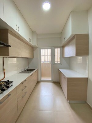 Kitchen in 3 BHK Apartment at Bhartiya Nikoo Homes Phase 2, Thanisandra Main Road – for Rent