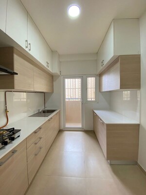 Kitchen in 3 BHK Apartment at Bhartiya Nikoo Homes Phase 2, Thanisandra Main Road – for Rent