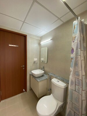Bathroom in 3 BHK Apartment at Bhartiya Nikoo Homes Phase 2, Thanisandra Main Road – for Rent