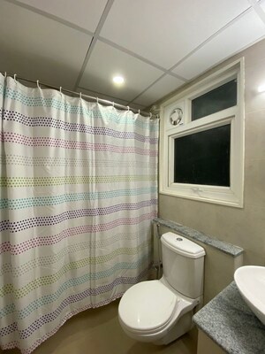 Bathroom in 3 BHK Apartment at Bhartiya Nikoo Homes Phase 2, Thanisandra Main Road – for Rent