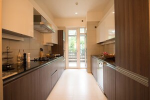 Kitchen in 4 BHK Apartment at Mahindra Luminare, Sector 59 – for Sale
