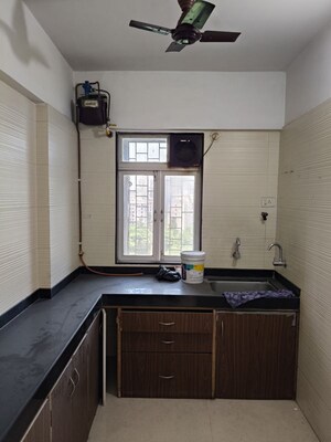 Kitchen in 1 BHK Apartment at Cosmos Classique, Ghodbunder Road – for Sale