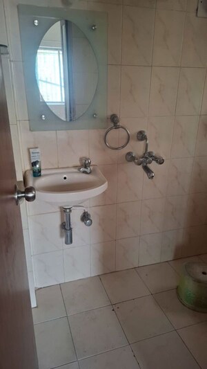 Bathroom in 4 BHK Apartment at Oberoi Sky City, Borivali East – for Rent