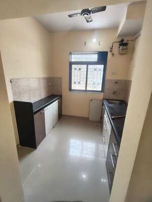 Kitchen in 1 BHK Apartment at Sanghvi Hills, Ghodbunder Road – for Rent