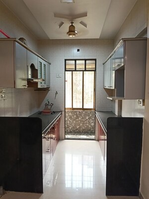 Kitchen in 2 BHK Apartment at Gajanan Tower, Dombivli West – for Sale