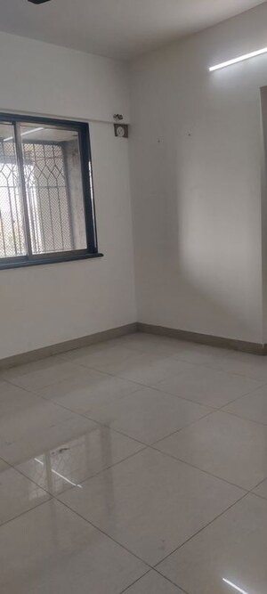 Room in 2 BHK Apartment at Palash Towers, Andheri West – for Rent