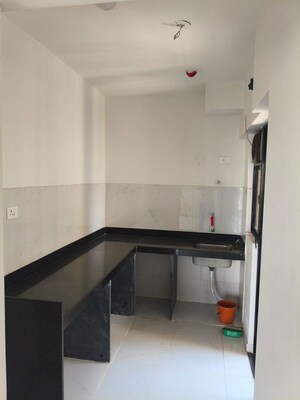Kitchen in 2 BHK Apartment at Runwal Gardens, Dombivli East – for Rent