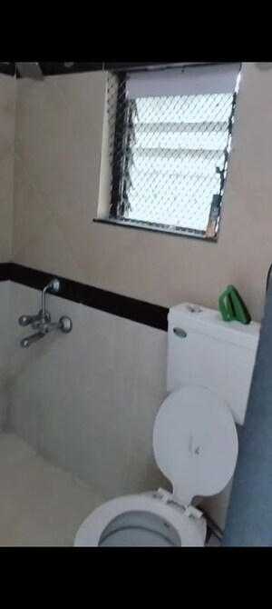 Bathroom in 3 BHK Apartment at New Mhada Towers, Andheri West – for Rent