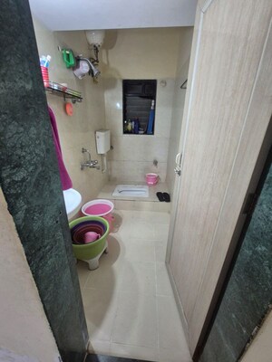 Bathroom in 2 BHK Apartment at Puranik City, Kasarvadavali – for Rent