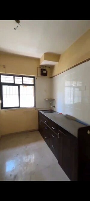 Kitchen in 2 BHK Apartment at Raunak Unnathi Greens, Kasarvadavali – for Rent