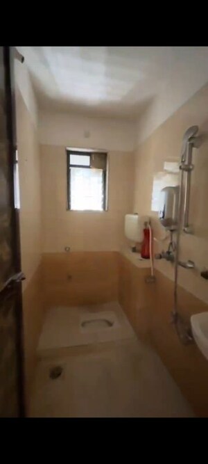 Bathroom in 2 BHK Apartment at Raunak Unnathi Greens, Kasarvadavali – for Rent