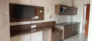 Kitchen in 1 RK Apartment at Paramount Golf Forest Studio Apartments - OAK Towe, Zeta I Greater Noida – for Rent