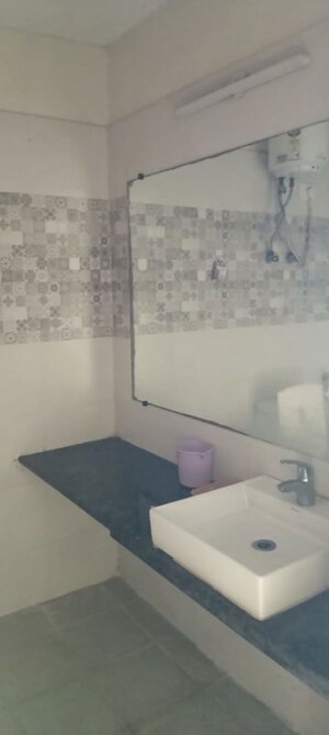 Bathroom in 1 RK Apartment at Paramount Golf Forest Studio Apartments - OAK Towe, Zeta I Greater Noida – for Rent