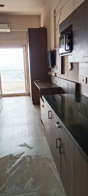 Kitchen in 1 RK Apartment at Paramount Golf Forest Studio Apartments - OAK Towe, Zeta I Greater Noida – for Rent