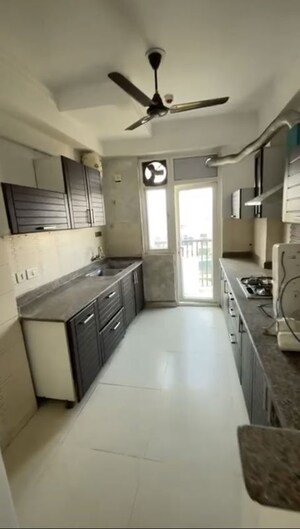 Kitchen in 3.5 BHK Apartment at Amrapali Platinum, Sector 119 – for Sale