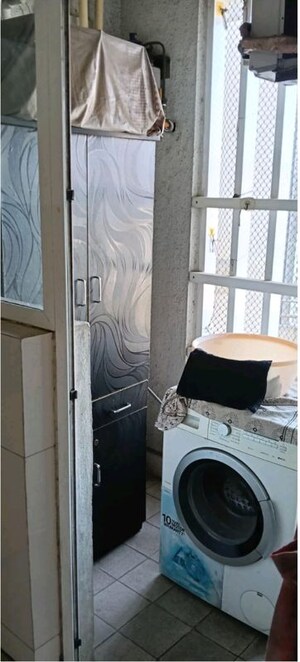 Laundry Area in 2 BHK Apartment at The Wadhwa Palm Beach Residency, Nerul Sector 4 – for Rent
