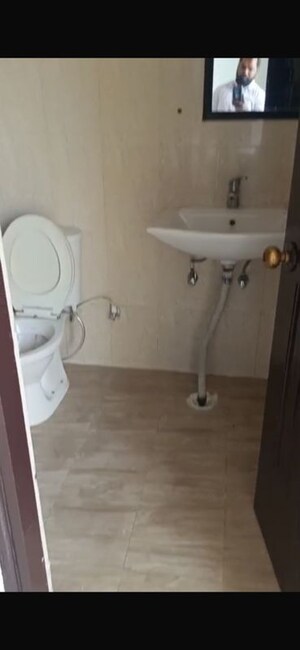 Bathroom in 2 BHK Apartment at Charms Castle Phase II, Raj Nagar Extension – for Sale