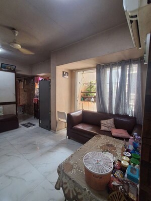 Living Room in 1.5 BHK Apartment at Vivekanand Nagar – for Sale