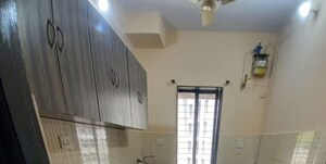 Kitchen in 2 BHK Apartment at Lalani Residency, Kavesar – for Sale
