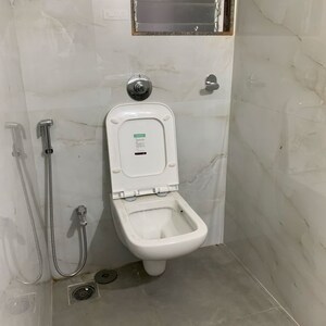 Bathroom in 2 BHK Apartment at Kosmos Kedar Darshan, Kastur Park – for Rent