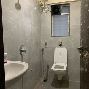 Bathroom in 2 BHK Apartment at Kosmos Kedar Darshan, Kastur Park – for Rent