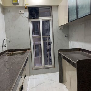 Kitchen in 2 BHK Apartment at Kosmos Kedar Darshan, Kastur Park – for Rent