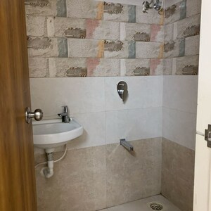 Bathroom in 1.5 BHK Apartment at Unique Abode, Kastur Park – for Rent