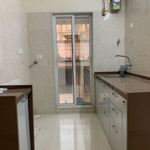 Kitchen in 1.5 BHK Apartment at Unique Abode, Kastur Park – for Rent