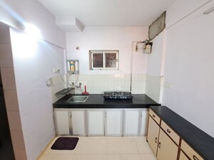 Kitchen in 1 BHK Apartment at Amaltas CHS Vasant Vihar, Vasant Vihar – for Sale