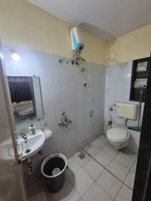 Bathroom in 2 BHK Apartment at Puranik City, Kasarvadavali – for Rent