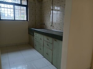 Kitchen in 1 BHK Apartment at Green Acres Apartment, Waghbil – for Rent