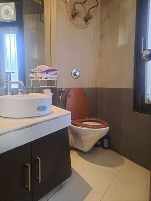 Bathroom in 3 BHK Apartment at Panchsheel Enclave – for Rent