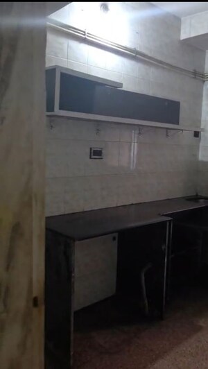 Kitchen in 2 BHK Apartment at Mangal Shantinagar CHS, Mira Road – for Rent