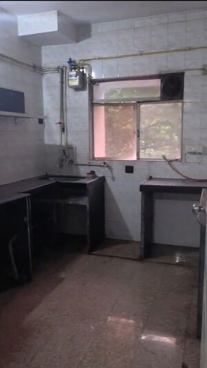Kitchen in 2 BHK Apartment at Mangal Shantinagar CHS, Mira Road – for Rent