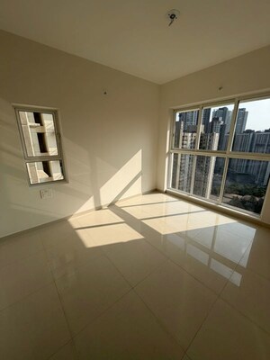 Living Room in 2 BHK Apartment at Lodha Amara, Kolshet Road – for Sale