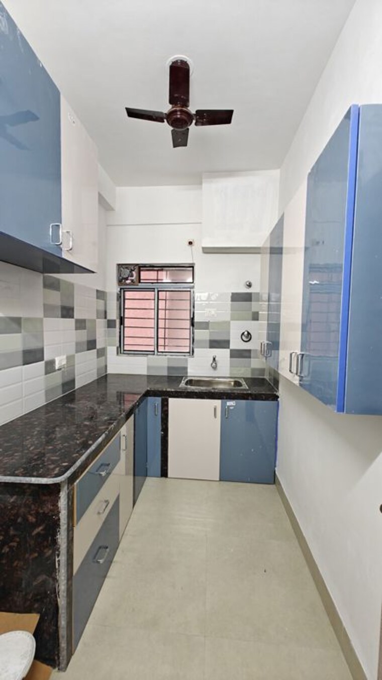 Kitchen, natural-city-laketown 3 Bedroom 1200 Sq.Ft. Apartment In Lake Town Kolkata 10337104