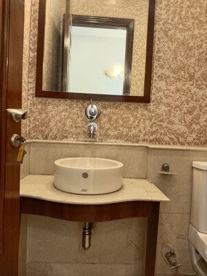 Bathroom in 4 BHK Apartment at Vasant Vihar – for Rent