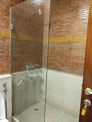 Bathroom in 4 BHK Apartment at Vasant Vihar – for Rent