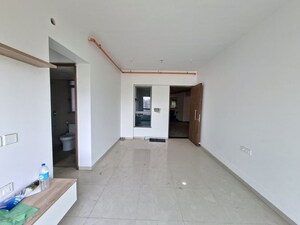 Living Room in 2 BHK Apartment at Kalpataru Immensa D, Kolshet Road – for Sale