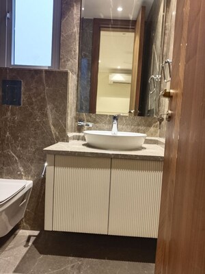 Bathroom in 4 BHK Apartment at Vasant Vihar – for Rent