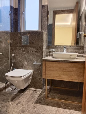Bathroom in 4 BHK Apartment at Vasant Vihar – for Rent