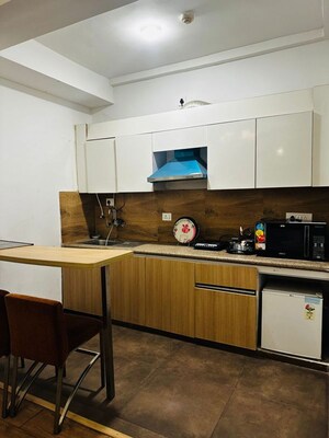 Kitchen in 1 RK Apartment at Nimbus The Golden Palm, Sector 168 – for Sale