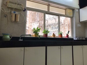 Kitchen in 2 BHK Apartment at Lokhandwala Complex – for Sale