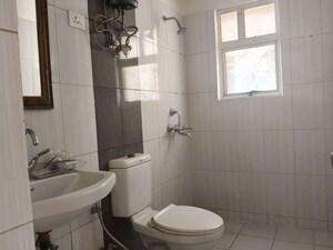 Bathroom in 2.5 BHK Apartment at Landcraft Golf Links, Pandav Nagar – for Rent