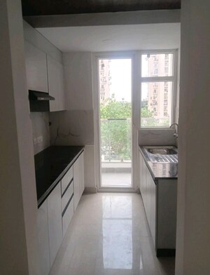 Kitchen in 2 BHK Apartment at Nimbus The Express Park View II, Chi V Greater Noida – for Rent