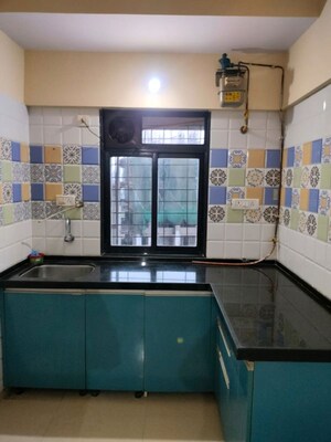Kitchen in 1 BHK Apartment at Raunak Delight, Owale – for Rent