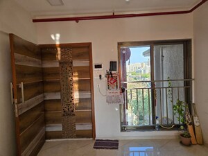 Living Room in 2 BHK Apartment at Shree Krishna CHS Kandivali, Kandivali West – for Rent